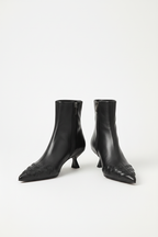 Minimalist studio shot - Fashionable knit ankle boots