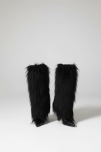 Minimalist studio shot - Long boots with tassels and stiletto heels